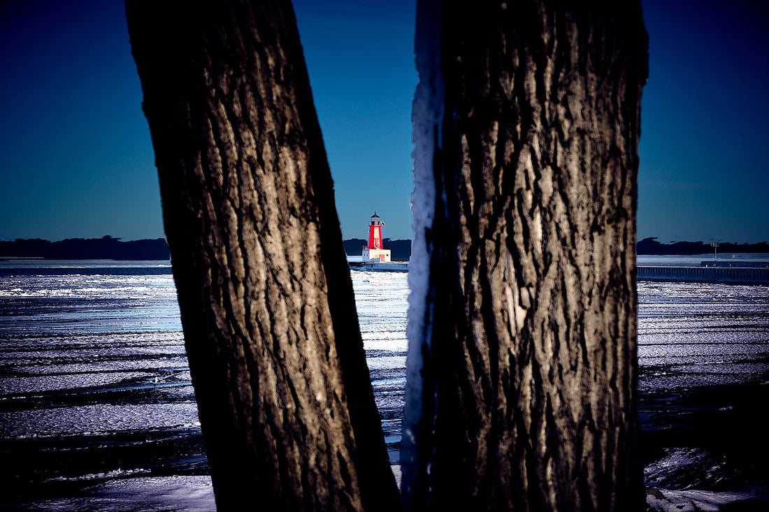 Image of a lighthouse on a frozen lake. Captured by Jonnise Macomson
