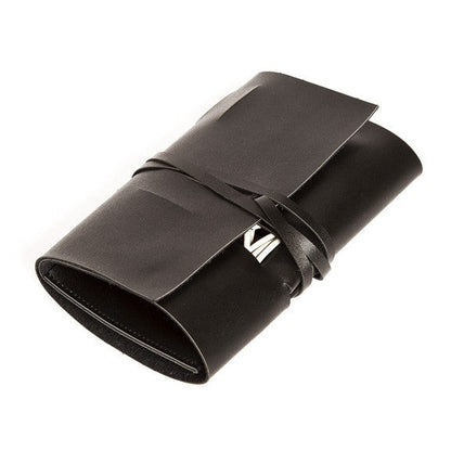 Black leather travel cord oranizer with a strap on a white background