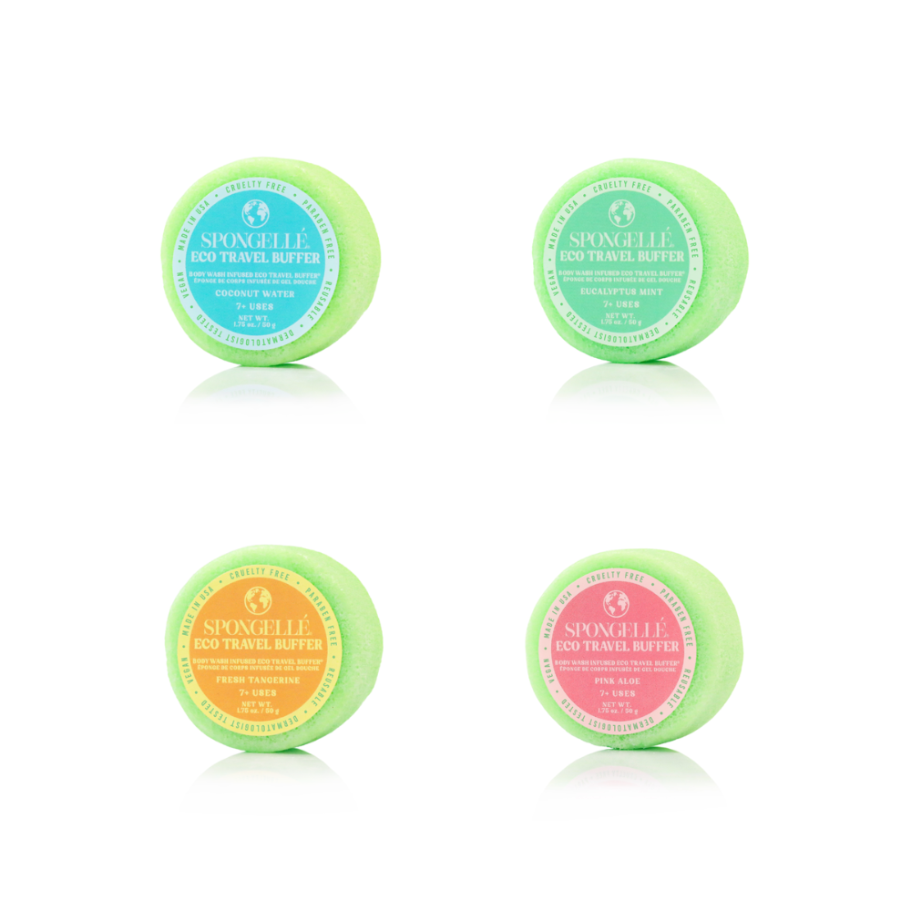 Four small containers of Spongelle eco travel butter on a white background