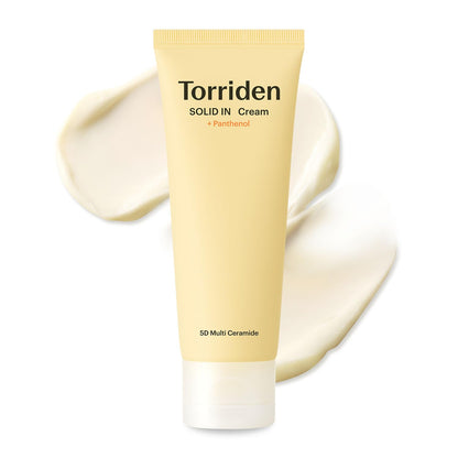 Torriden Solid In Cream tube with cream spread on a white background