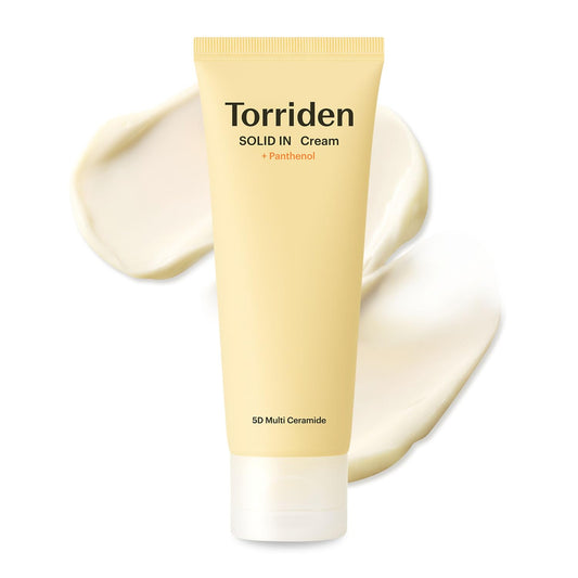 Torriden Solid In Cream tube with cream spread on a white background
