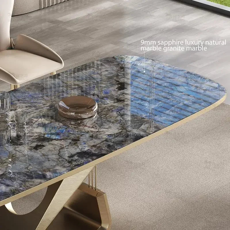 Marble dining table with gold base in a modern interior setting
