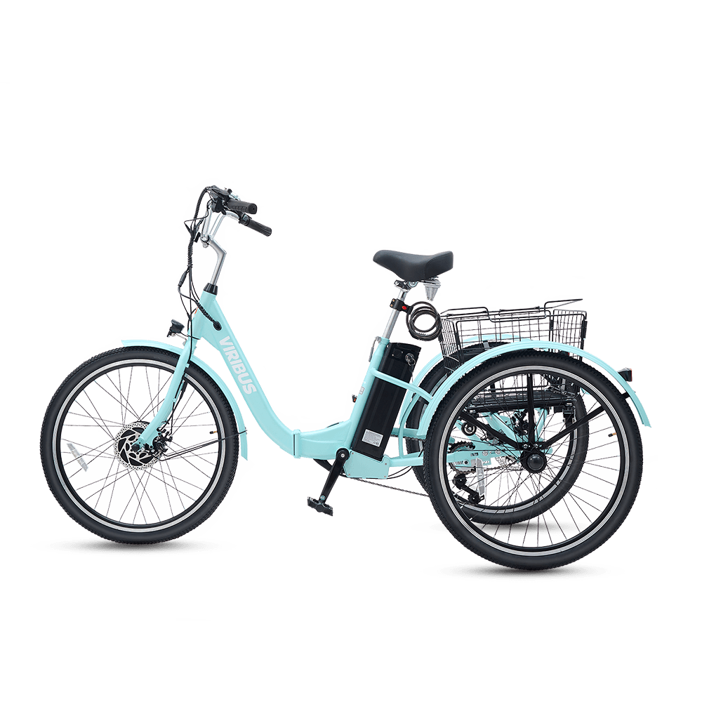 Light blue tricycle with basket on a black background