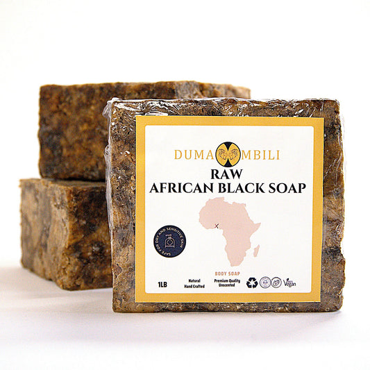 raw african black soap on a white background