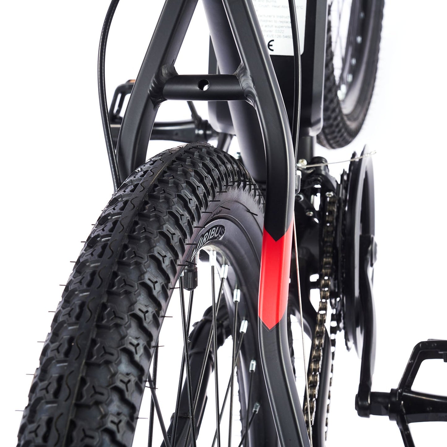 Close-up of a bicycle wheel with a red reflector on a white background