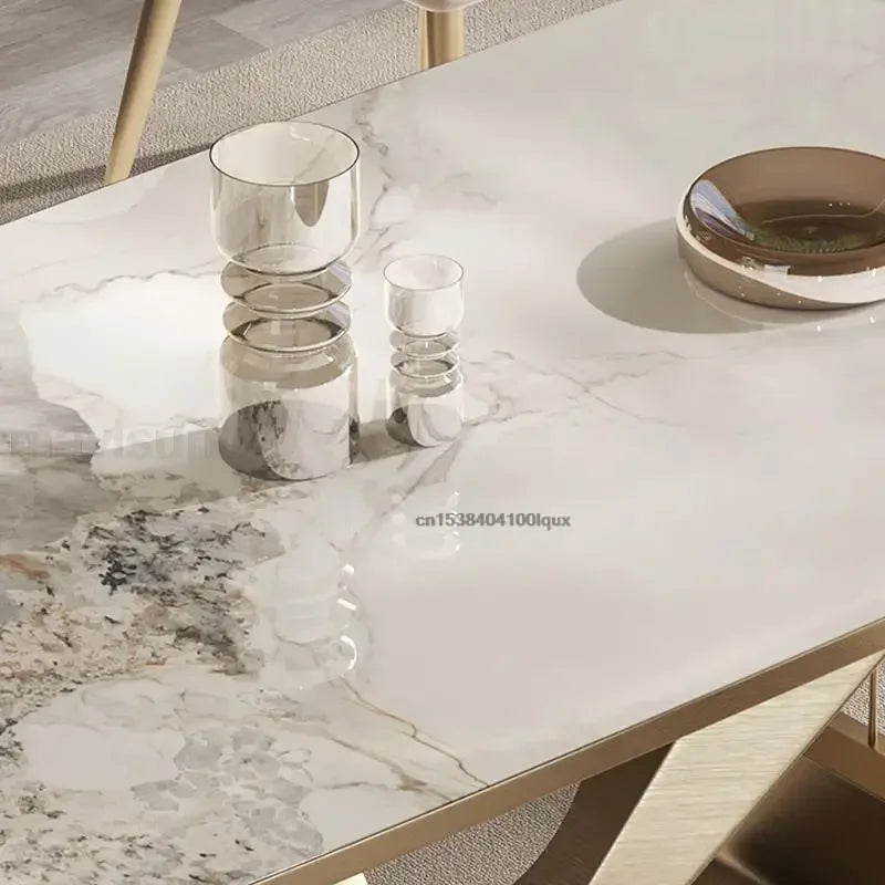Marble-patterned table with decorative items on a neutral background