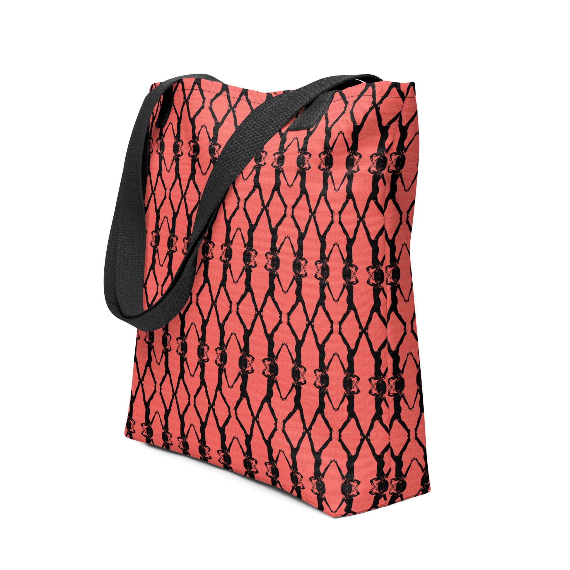 Red tote bag with black geometric pattern on a white background