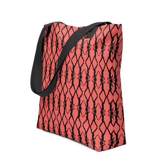 Red tote bag with black geometric pattern on a white background
