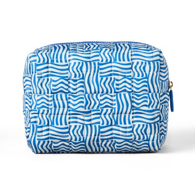 Blue and white patterned cube-shaped bag on a white background