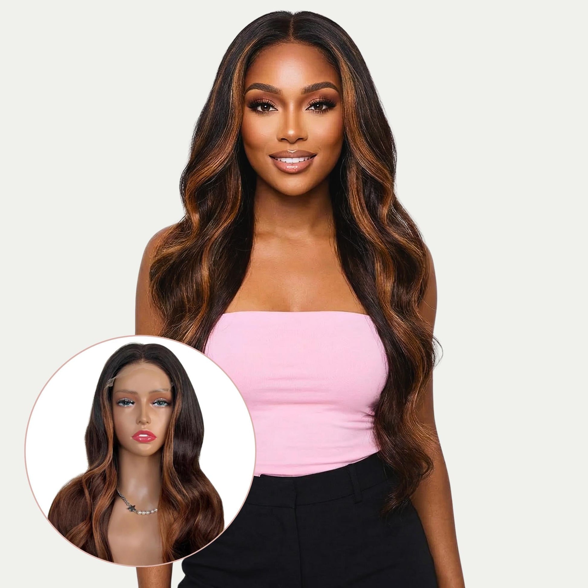 Woman with long wavy hair wearing a pink top on a plain background
