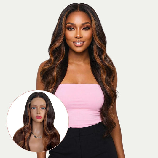 Woman with long wavy hair wearing a pink top on a plain background