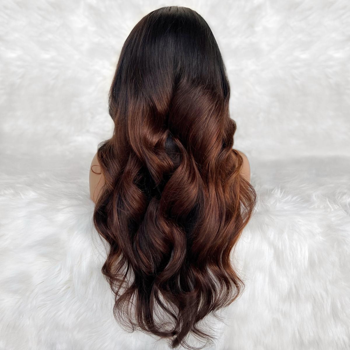 Mannequin head with long, wavy hair on a white textured background