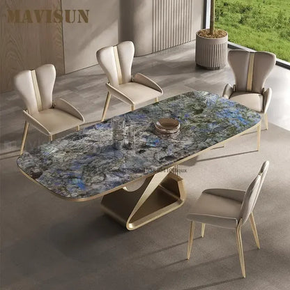 Dining table with marble-like surface and four chairs in a modern room setting.