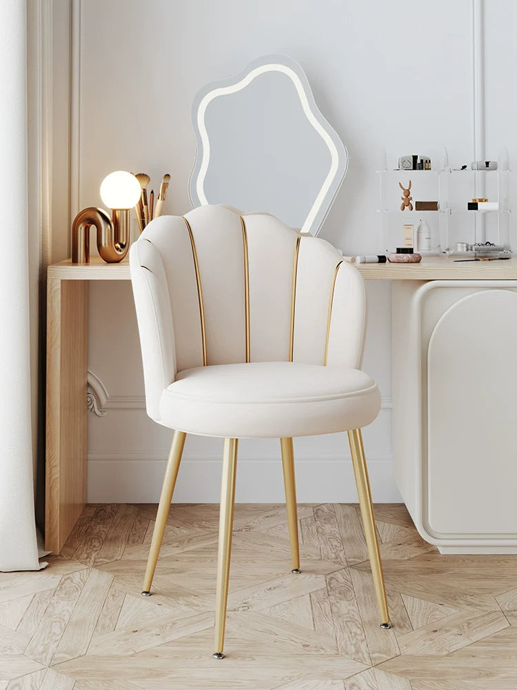 Decorative chair with gold legs in a stylish room setting