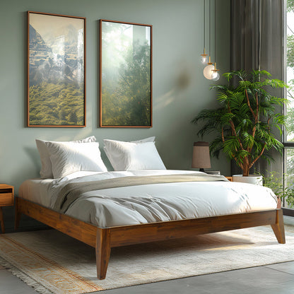 Modern bedroom with wooden bed, framed pictures, and a plant.
