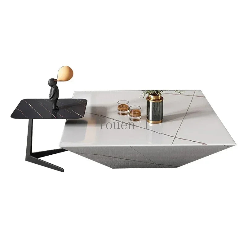 Modern coffee table with a white marble top and black base on a white background