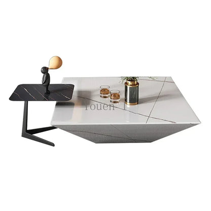 Modern coffee table with a white marble top and black base on a white background