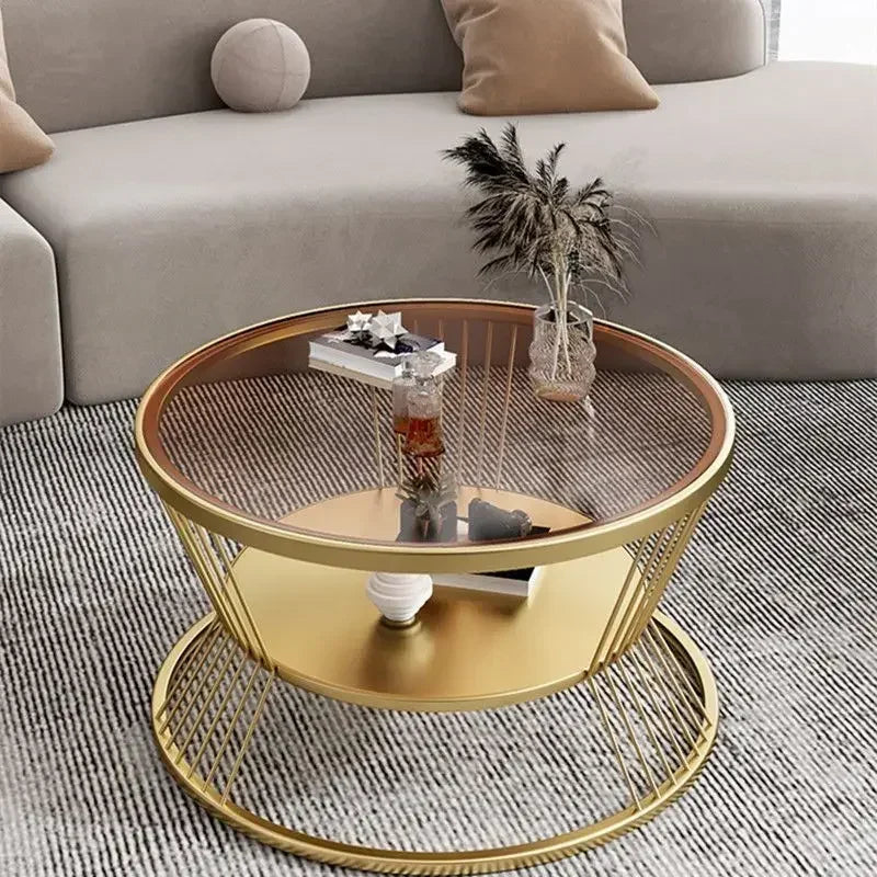 Gold coffee table with decorative items in a living room setting
