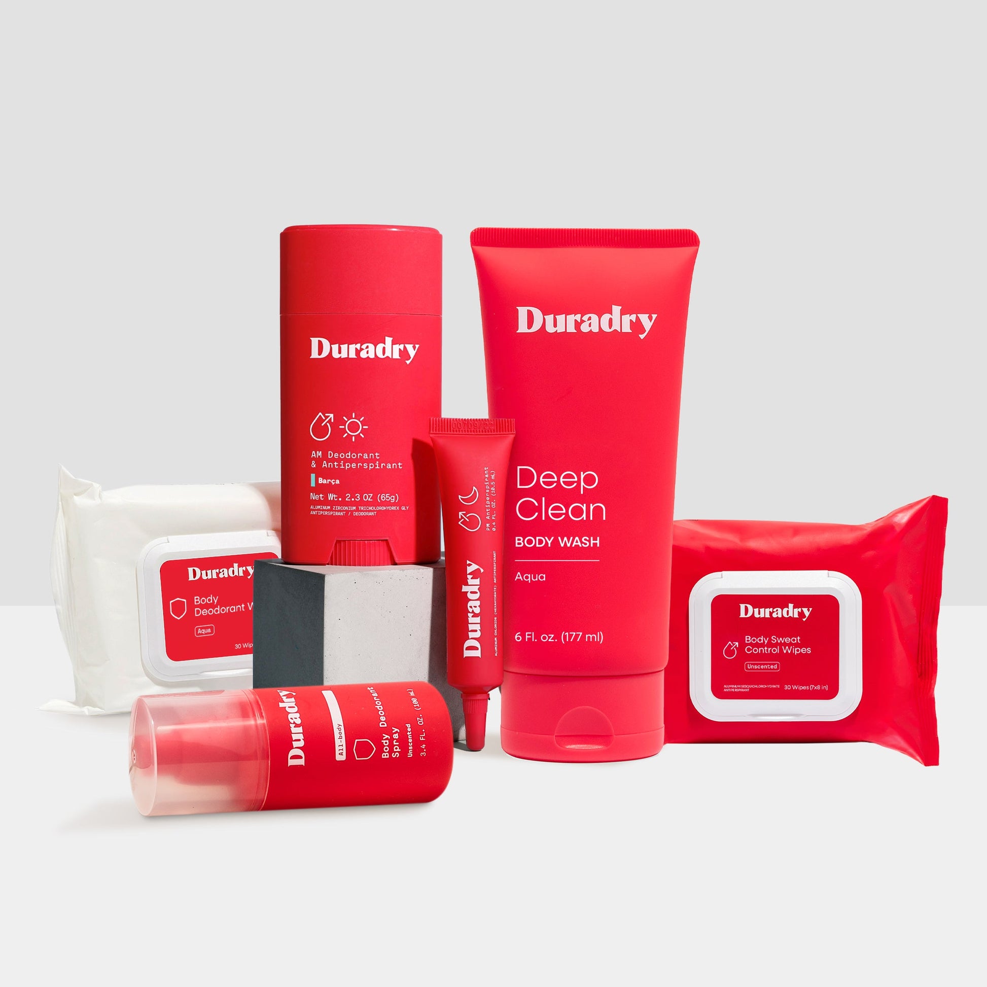 Duradry skincare products including a bottle, tube, and packets on a white background