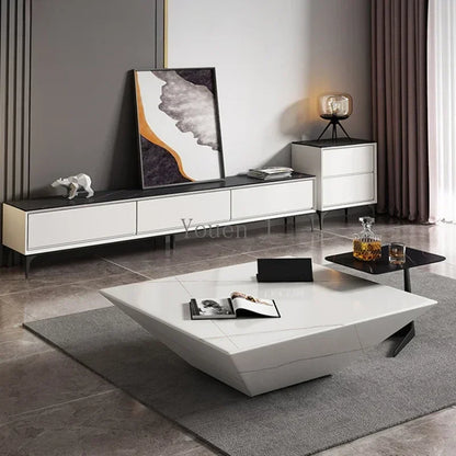 Modern living room with white furniture, including a coffee table and sideboard.