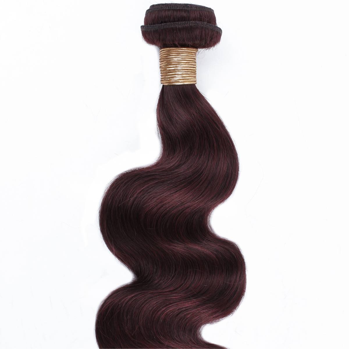 Brown hair extensions with a gold band on a white background