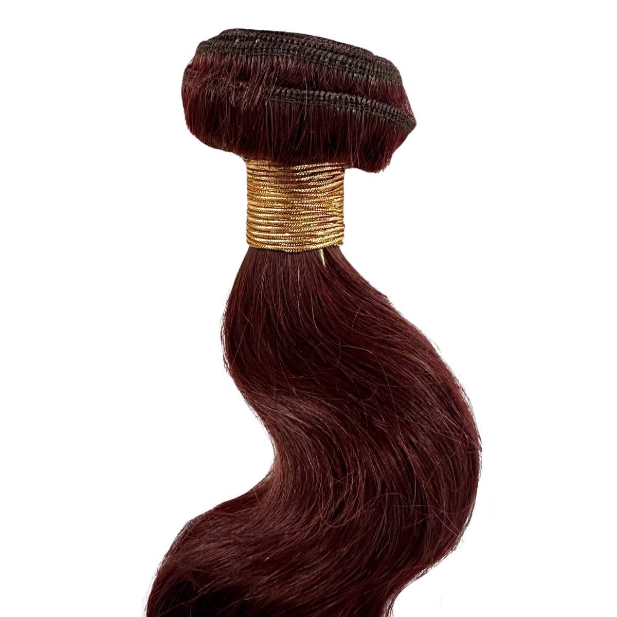Brown hair bundle with a gold band on a white background