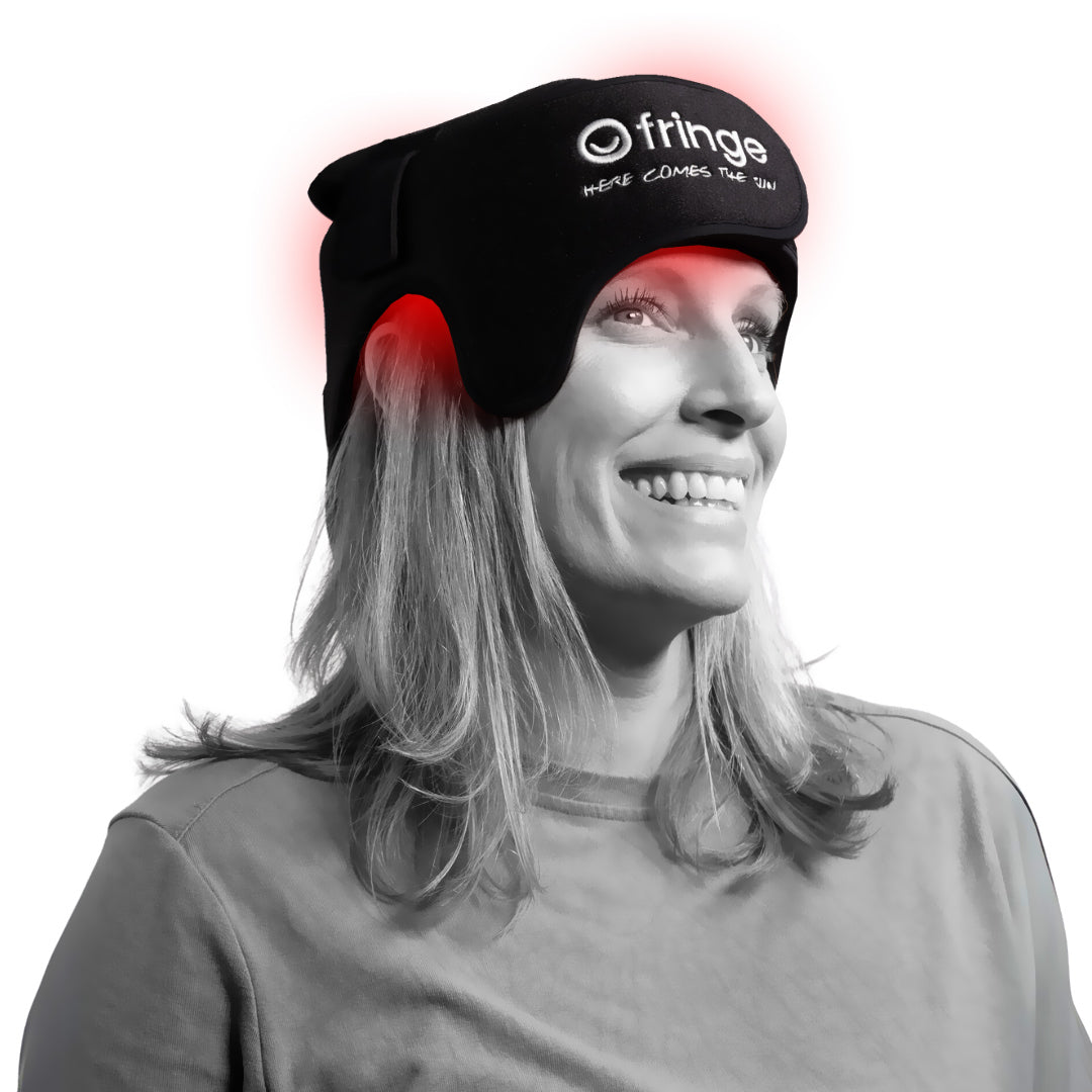 Person wearing a black headband with red lights and 'frings' branding on a white background