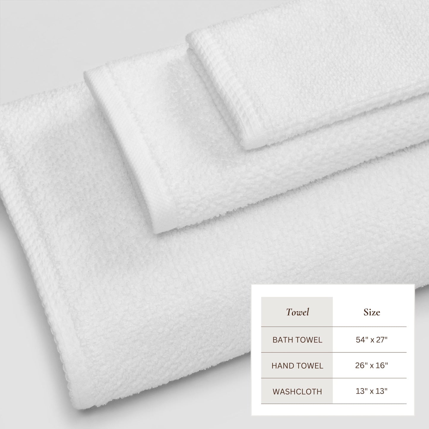 Set of white towels with size chart on a light gray background