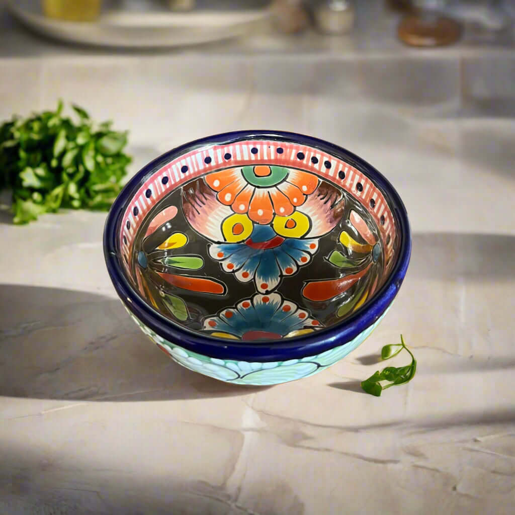 Colorful ceramic bowl with floral patterns on a kitchen counter