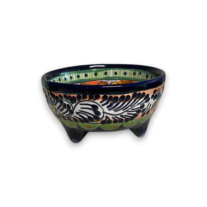 Decorative ceramic bowl with colorful patterns on a white background