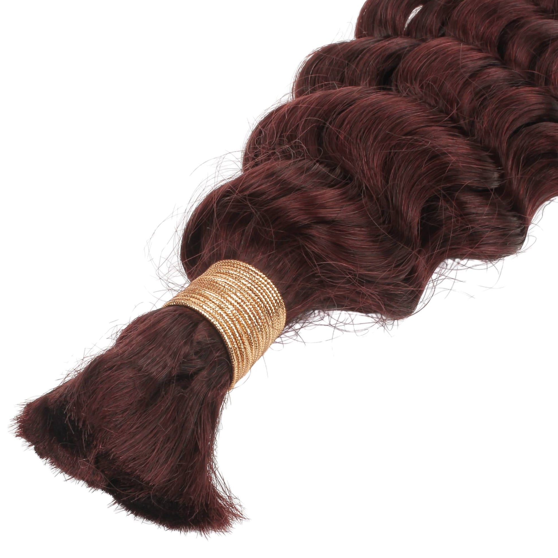 Braided hair extensions with a gold band on a white background
