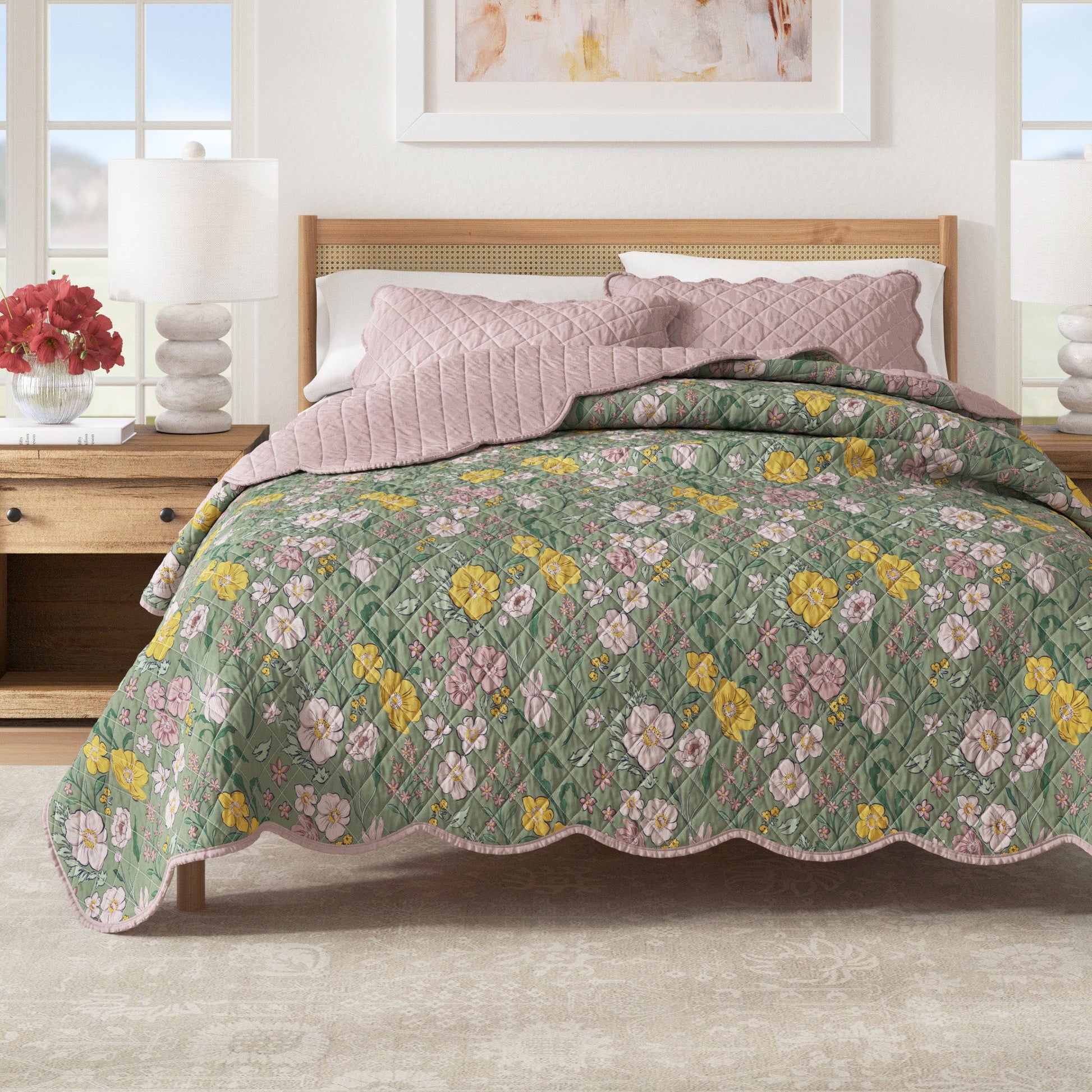 Floral quilt on a bed in a bedroom setting with a lamp and decor.