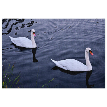Original image of two swans on a lake printed on a jigsaw puzzle