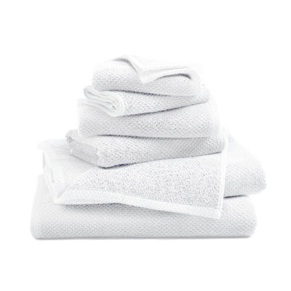 Stack of white towels on a white background