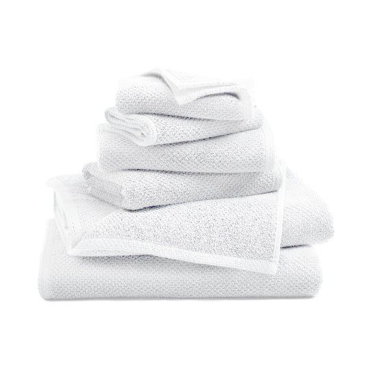 Stack of white towels on a white background
