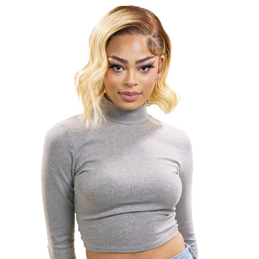Woman wearing a gray long-sleeve crop top against a white background