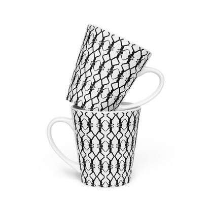 White mug with black geometric pattern on a white background