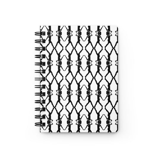White notebook with black spiral binding on a white background