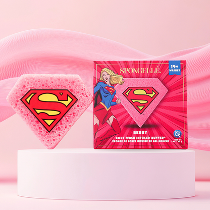 Pink sponge with Superman logo and packaging on a pink background