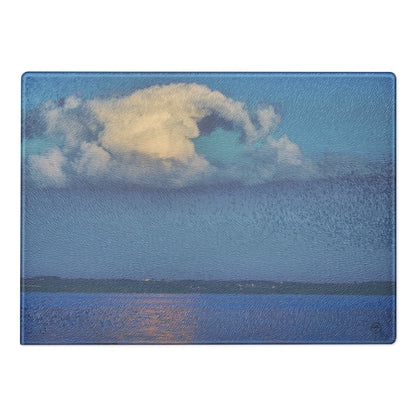 Your Suggested Brand cutting board with a design of a cloud over water on a blue background