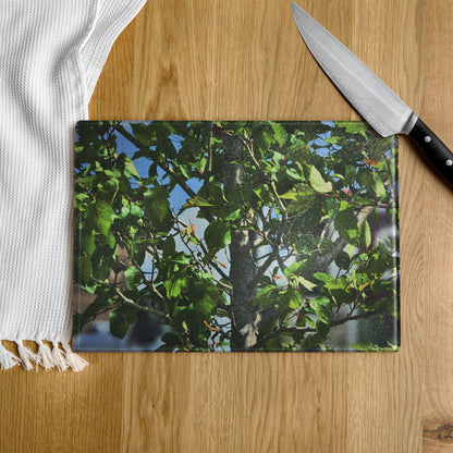 Chopping board with tree design on a wooden surface
