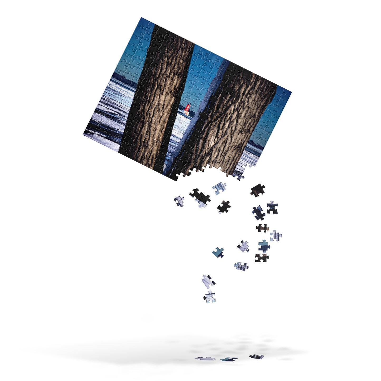 Your Suggested Brand jigsaw puzzle with image of a snowy lake and lighthouse with the pieces falling from the bottom right corner, over a white background.