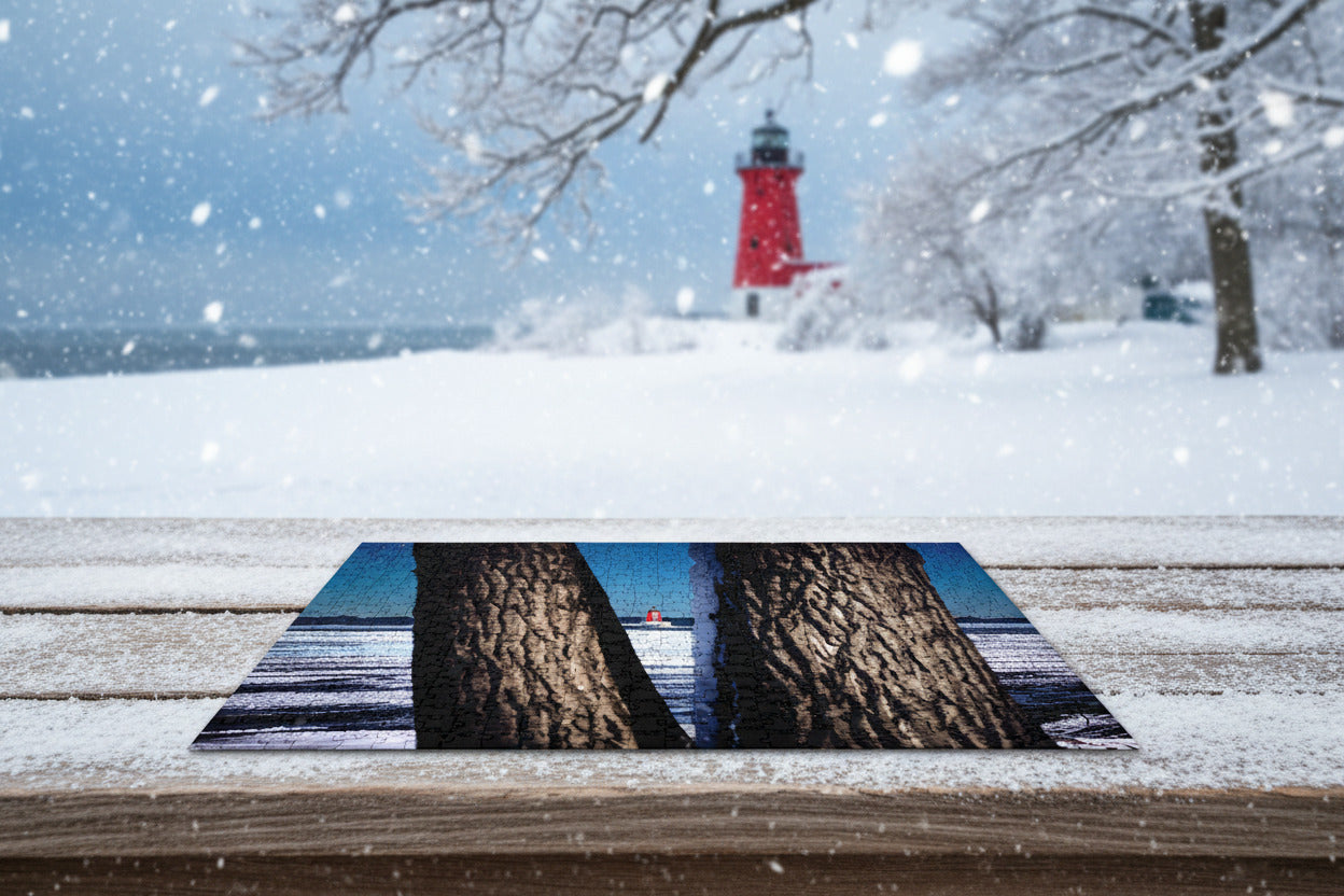 Your Suggested Brand Jigsaw puzzle with a lighthouse scene framed by tree trunks.